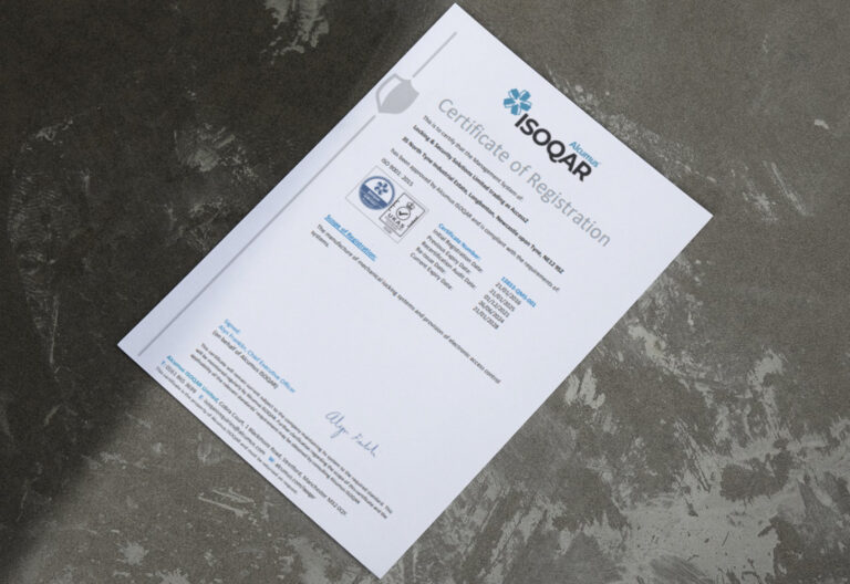 Photograph of a Certificate of Registration issued by Alcumus ISOQAR - confirming that Access 2 has passed their ISO 9001 audit.